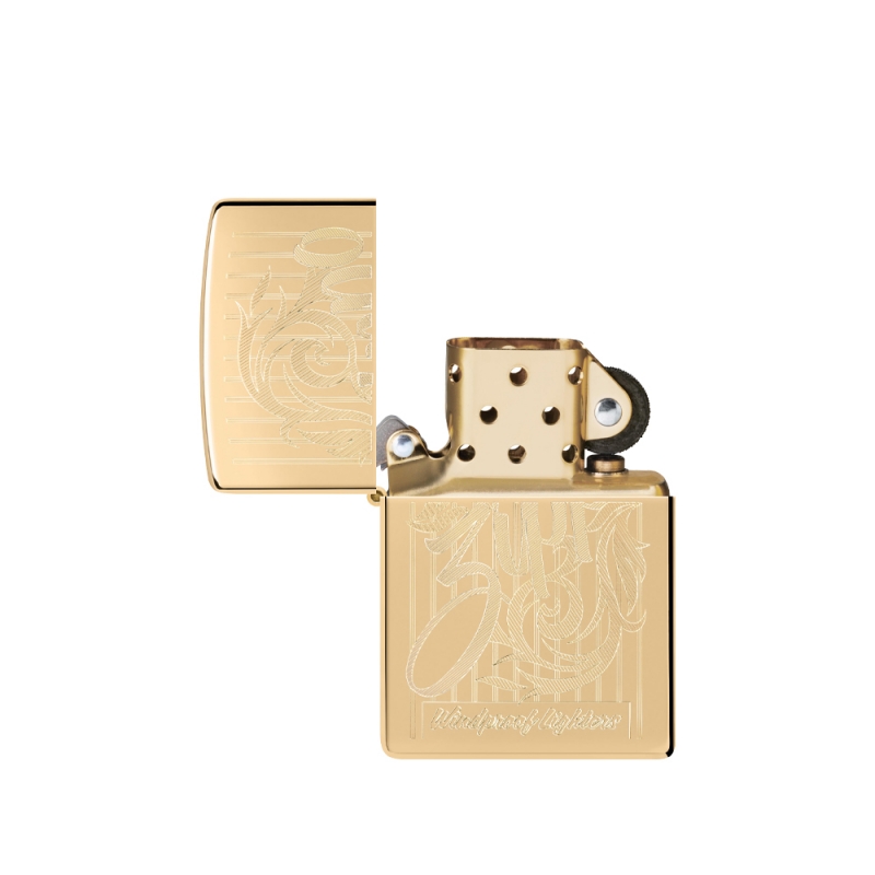otworzona złota zapalniczka Zippo z pozłacaną górą otworzona złota zapalniczka Zippo z pozłacaną górą