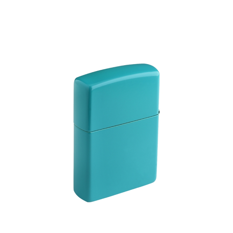 metalowa zapalniczka z intensywnym odcieniem turkusu i eleganckimi złotymi akcentami grawerunku