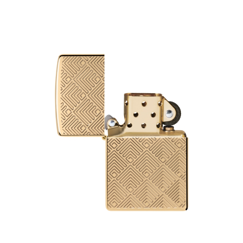otwarta zapalniczka z widocznym srebrzystym kominkiem który kontrastuje z ciepłym złotym wykończeniem