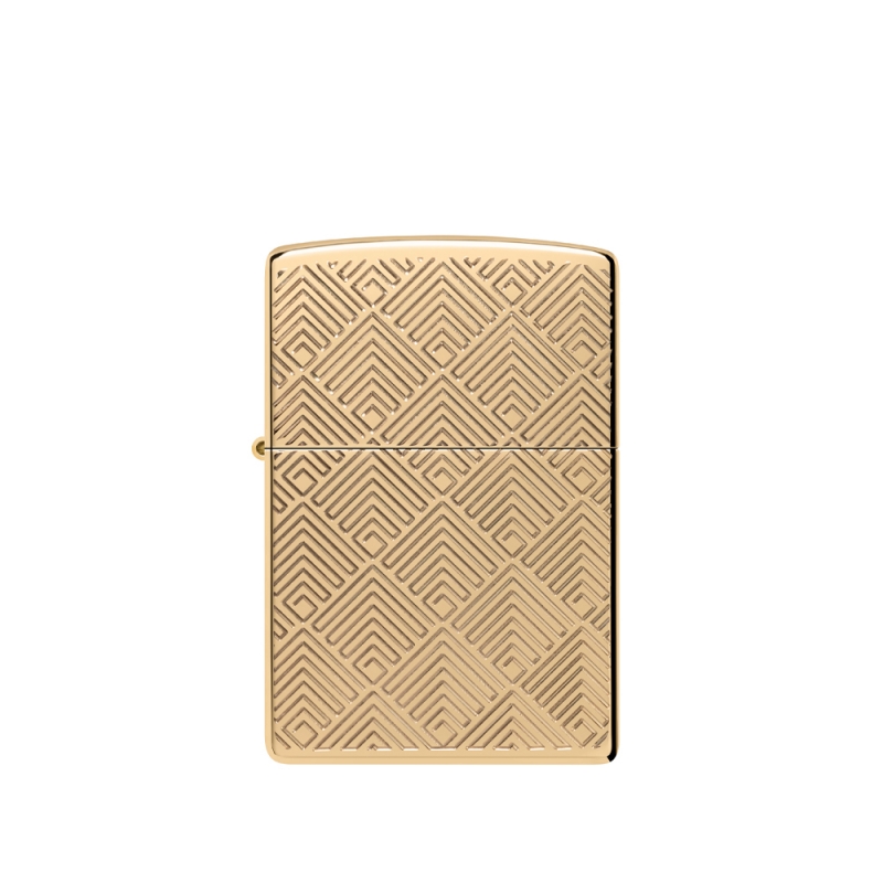 metalowa zapalniczka z efektem błyszczącego mosiądzu i bogato grawerowanym patternem wokół klasycznego logo płomienia