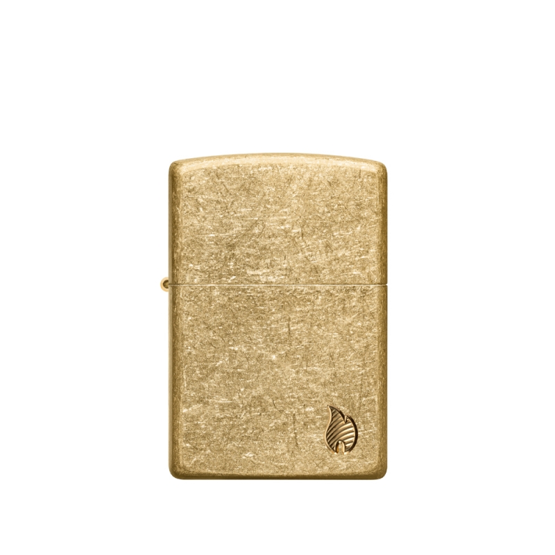 front zapalniczki z ciepłym, mosiężnym połyskiem metalu i minimalistycznym reliefem płomienia