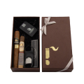 dwa cygara marki La Aurora Fuerte Sol Robusto i Escogidos Tor z akcesoriami w brązowym pudełku ze wstążką