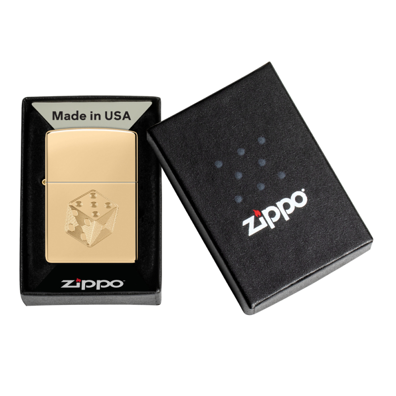 Złota zapalniczka Zippo Dice Design umieszczona w pudełku z wyciętym motywem kości na obudowie